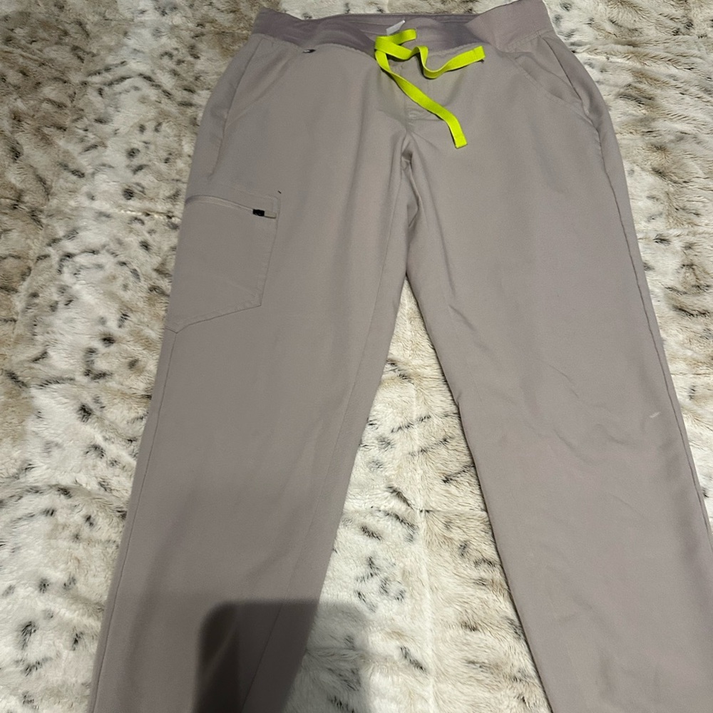 Woman’s light gray fig scrubs